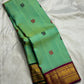 Pallu detail of mint green Kanchi Pattu Butta saree with Ganga Jamuna treatment