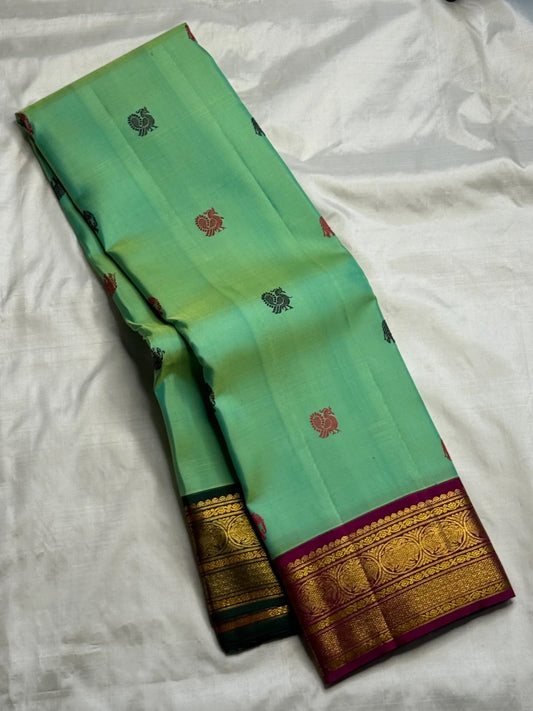 Pallu detail of mint green Kanchi Pattu Butta saree with Ganga Jamuna treatment