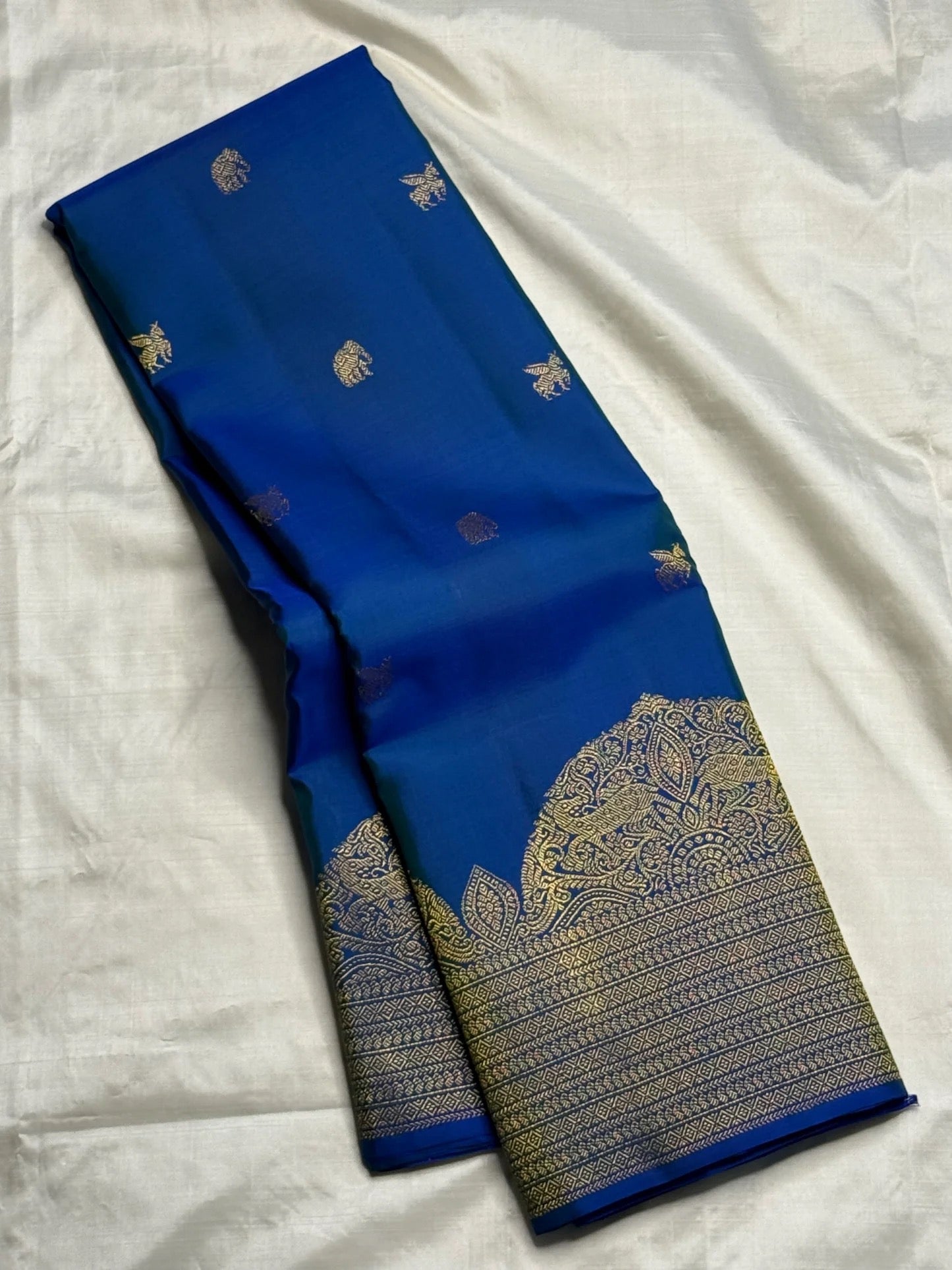 Pallu detail of royal blue KanchiPattu Butta saree with dense zari work