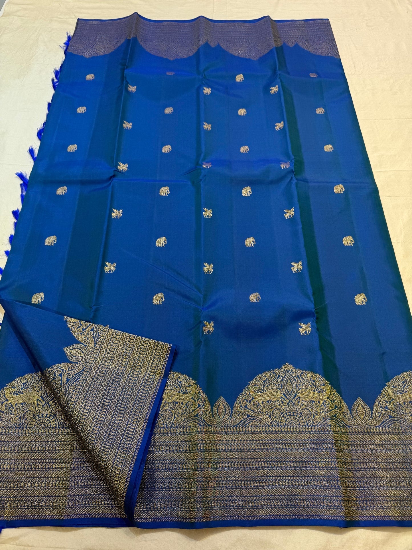 Royal blue KanchiPattu Butta saree folded view — Idam Living