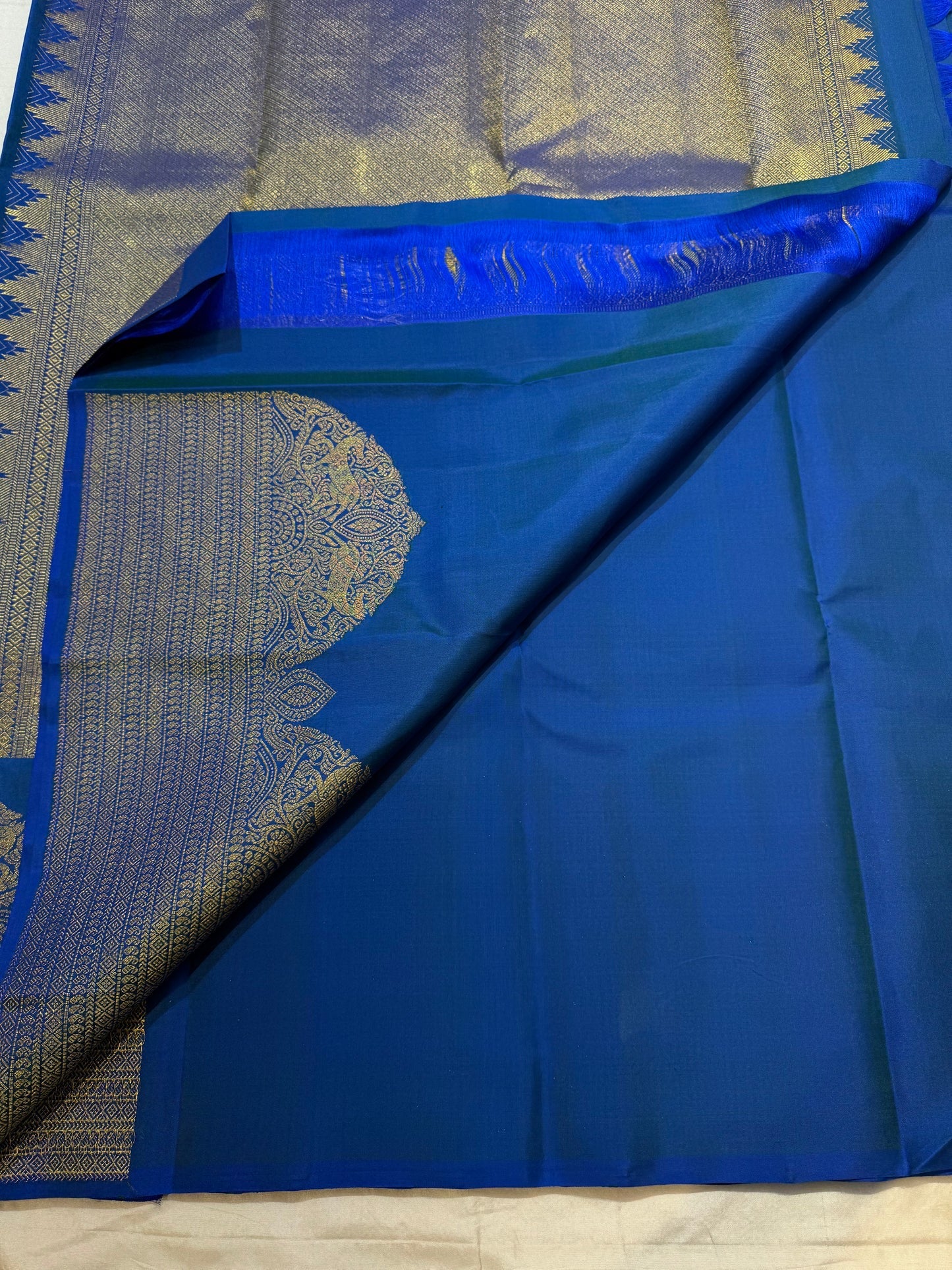 Zari detail close-up on royal blue KanchiPattu Butta saree