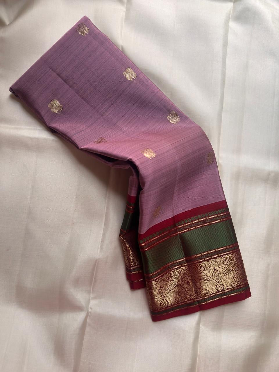 Close-up of antique gold zari Butta motifs on dusty lavender Kanchi Pattu silk saree