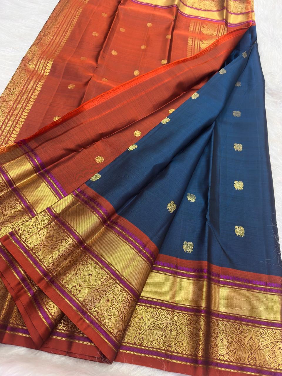 Raspberry and vermilion Vanasringaram peacock border on peacock blue Kanchipuram saree
