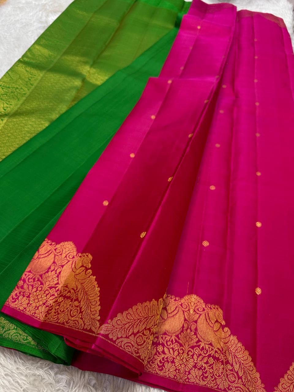 Pure Silk Kanchi Pattu saree in raspberry pink with scattered Butta motifs