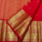 Vermilion Red KanchiPattu saree antique gold zari peacock border detail