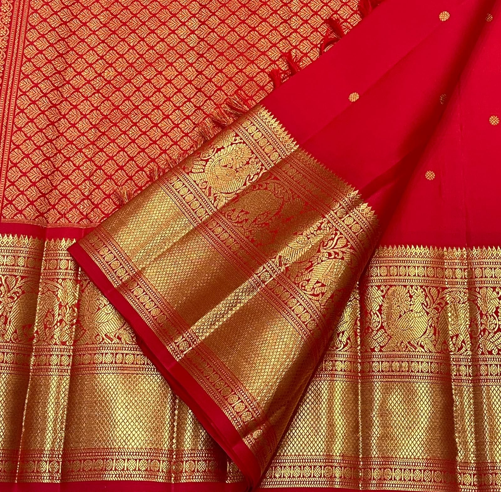 Vermilion Red KanchiPattu saree antique gold zari peacock border detail
