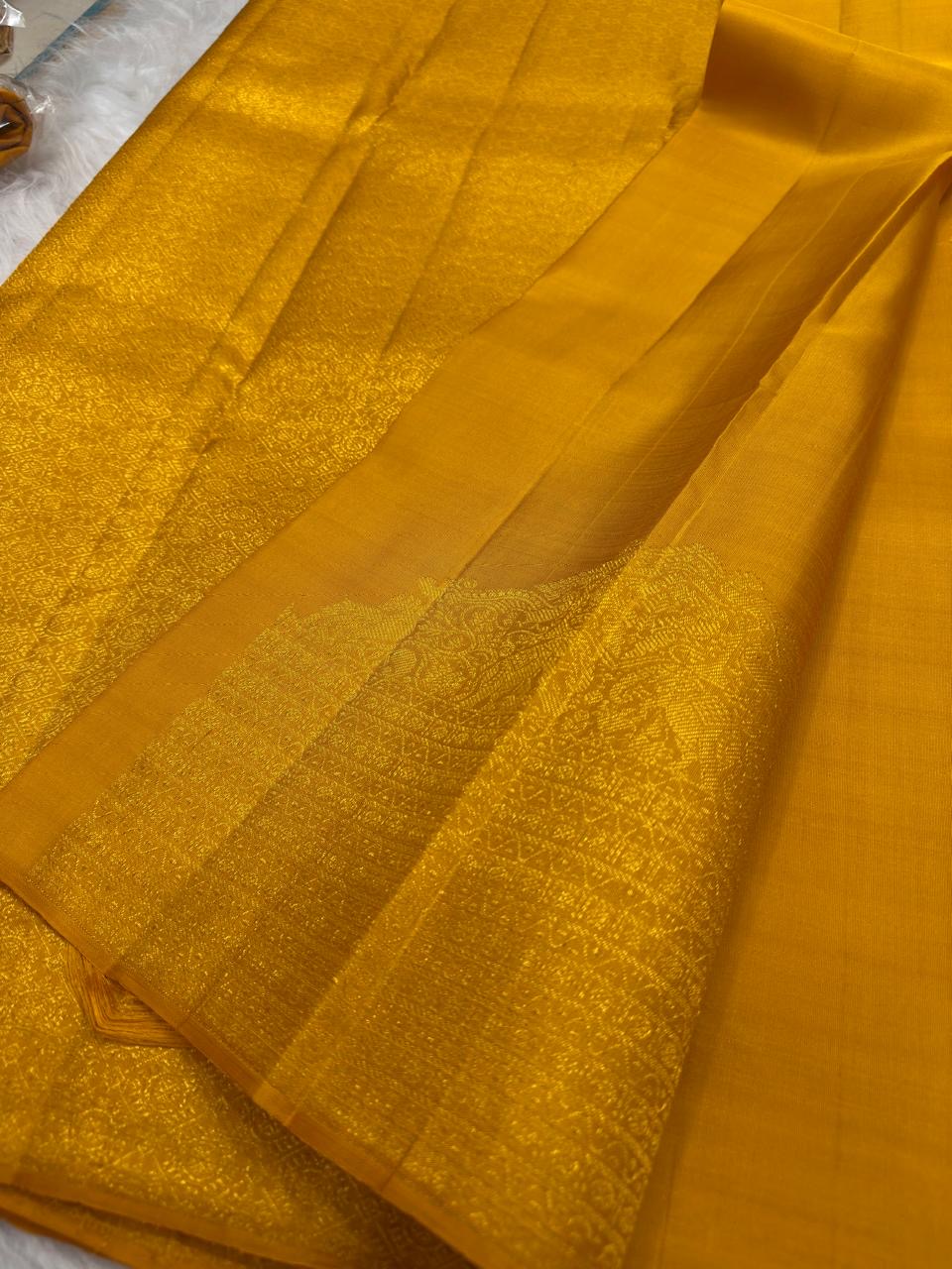 Pure silk Kancheepuram saree in golden turmeric — Silk Mark certified