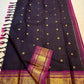 Body close-up of deep aubergine KanchiPattu saree showing petite gold zari buttas