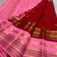 Pallu detail of pink Kanjeevaram Korvai saree with geometric and floral zari panels