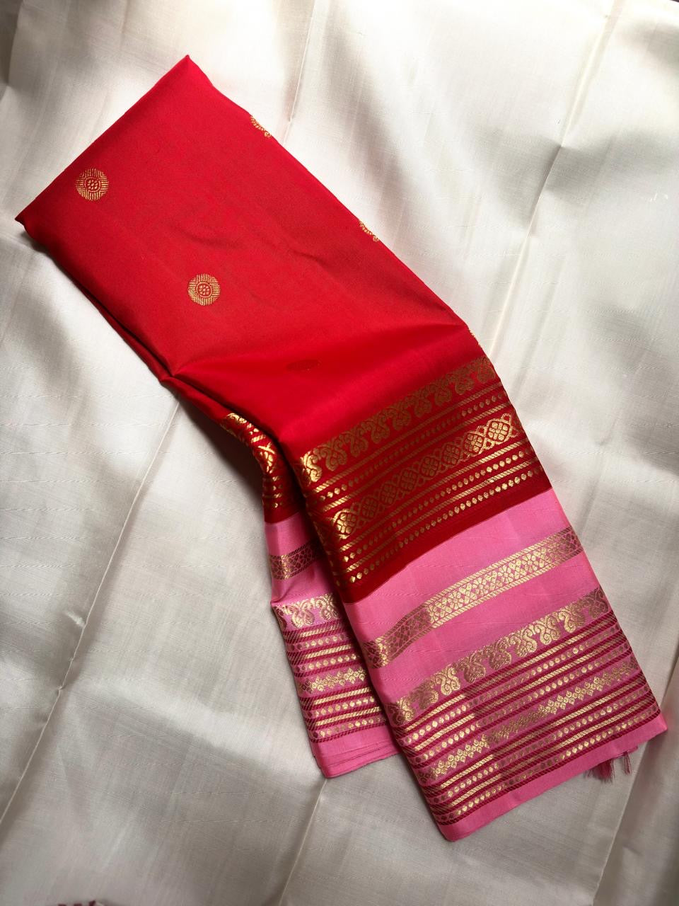 Zari panel detail close-up on pink Kanjeevaram Korvai saree