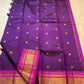 Vivid magenta Korvai border detail on royal purple Kanjipuram saree