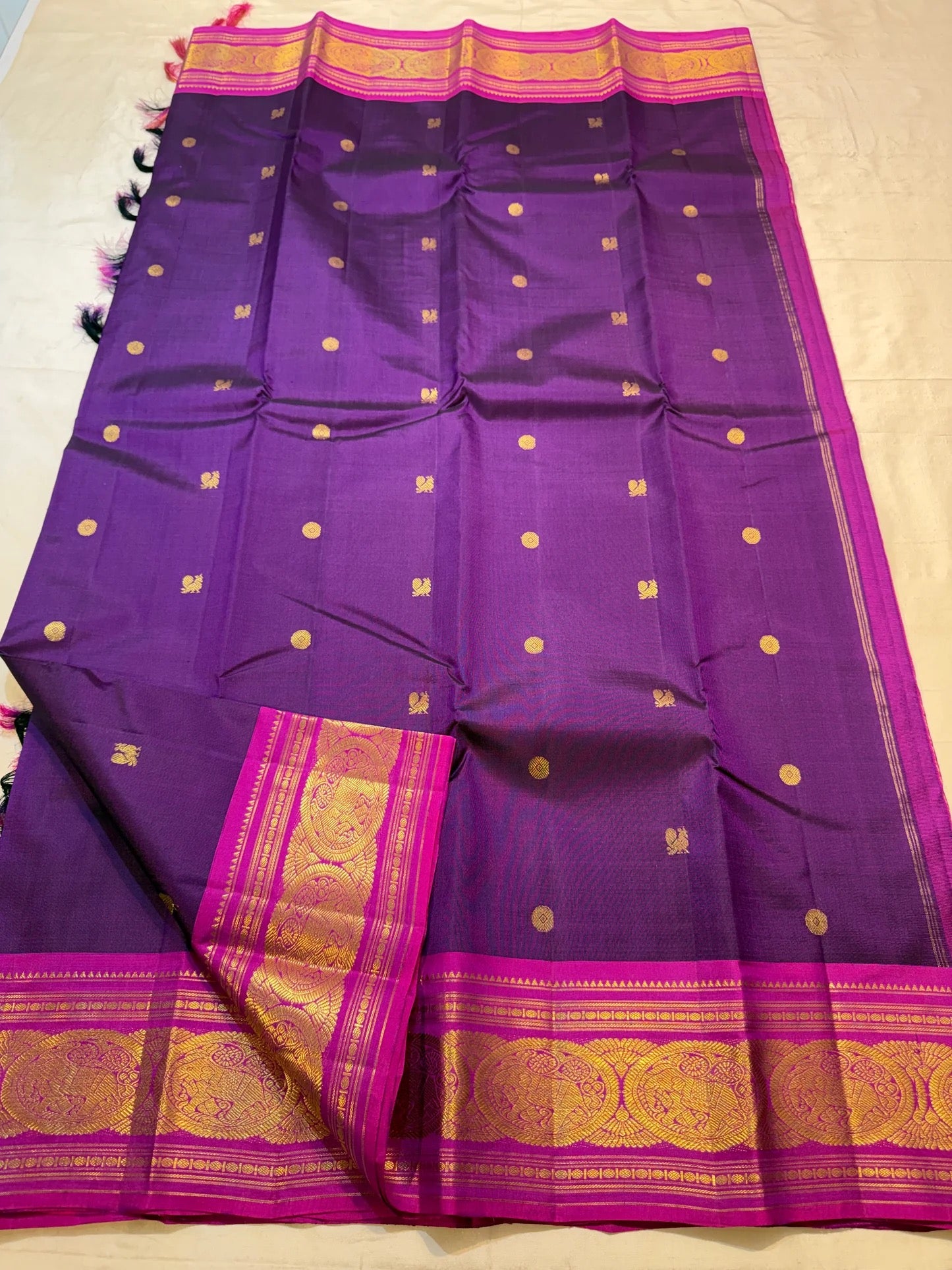 Vivid magenta Korvai border detail on royal purple Kanjipuram saree