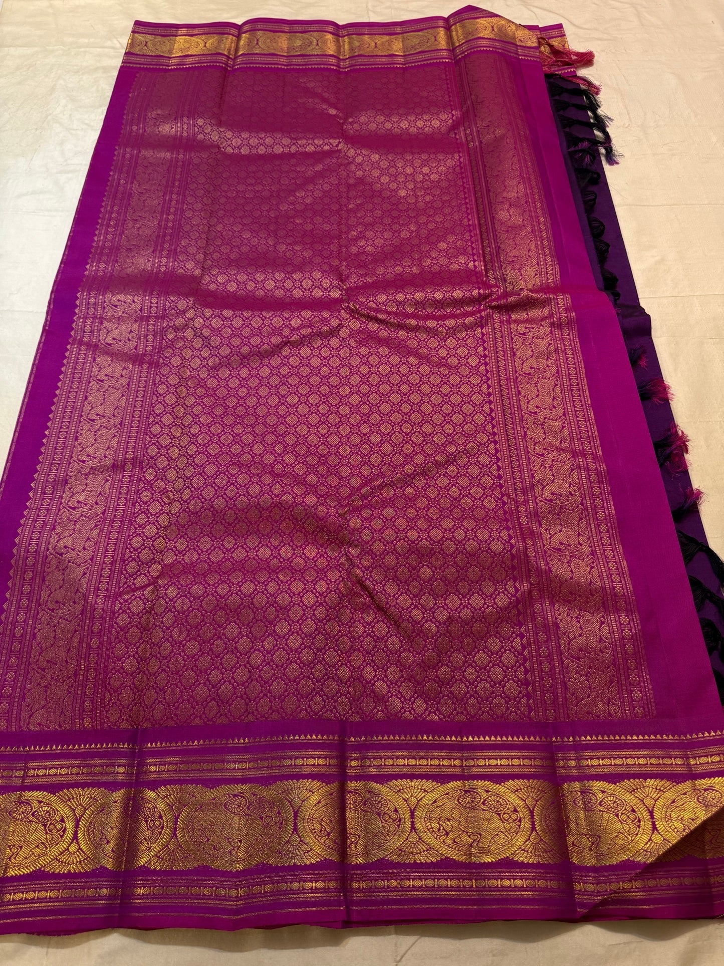 Pallu detail of royal purple Kanjipuram Korvai saree with large zari motifs