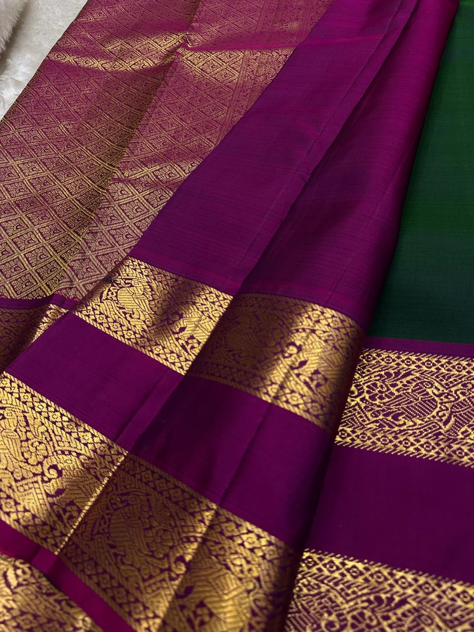 Deep forest green Kanjeevaram Rettapet saree folded view — Idam Living