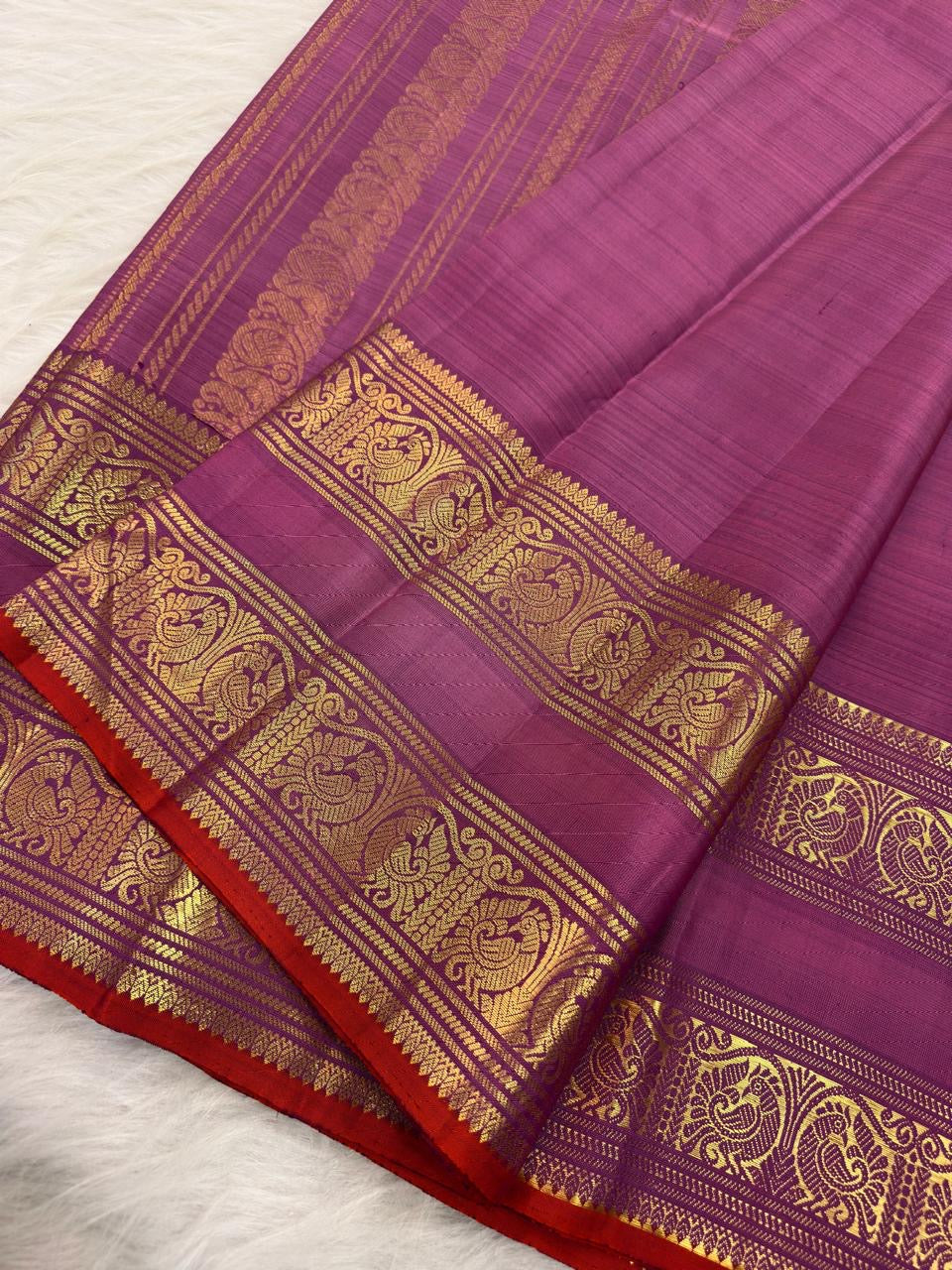 Pure Silk Kancheepuram saree in lavender showing Rettapet border
