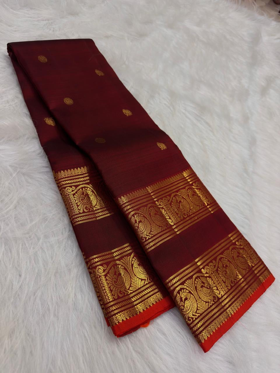 Pure Silk Kanjipuram saree in deep maroon showing Rettapet border