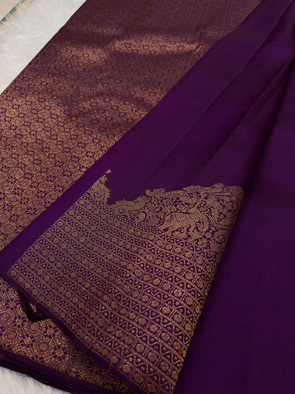 Pure silk Kanjeevaram saree in royal purple — border and pallu detail
