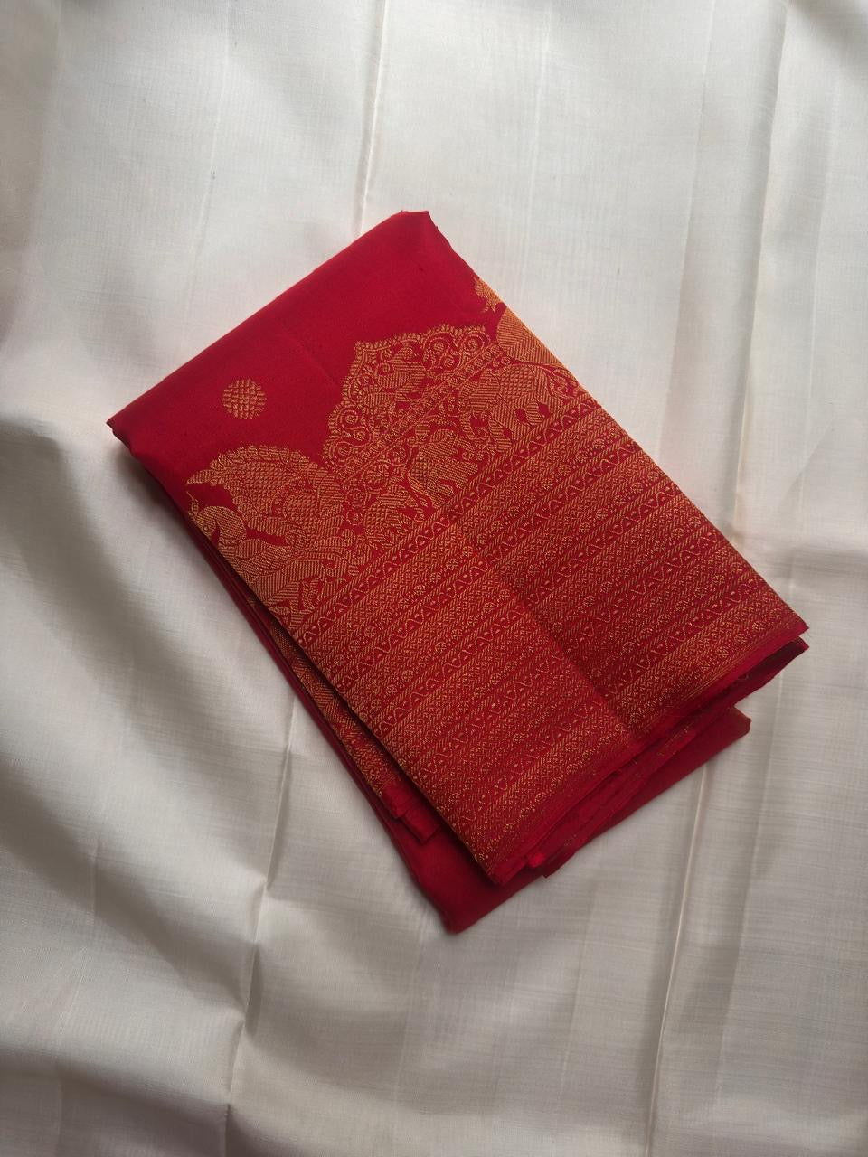 Pure silk Kanjipuram saree in ruby red — border and pallu detail