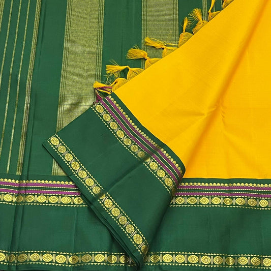 Pure Kanchipuram silk saree in yellow with rudhraksham motifs woven in traditional gold zari and mustard green rettapet border