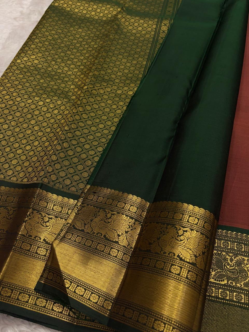 Burnished Brick pure silk Kancheepuram saree, Butta weave with Deep Green border — body weave close-up