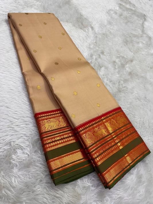 Pure Kanjivaram silk saree with Kamalam butta and traditional gold zari