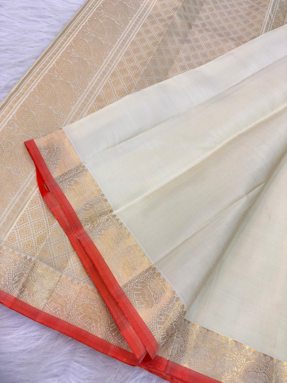 Ivory Handwoven Pure Silk Kanjivaram Saree with Small Gold Buttas & Petite Zari Elephant Border