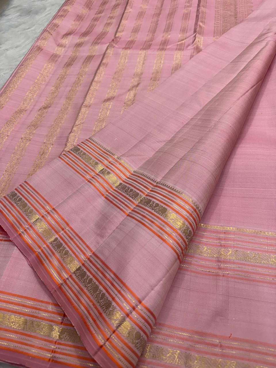 Pure Kanjeevaram silk saree body close-up, Rettapet border and Mayil Kamalam zari buttas