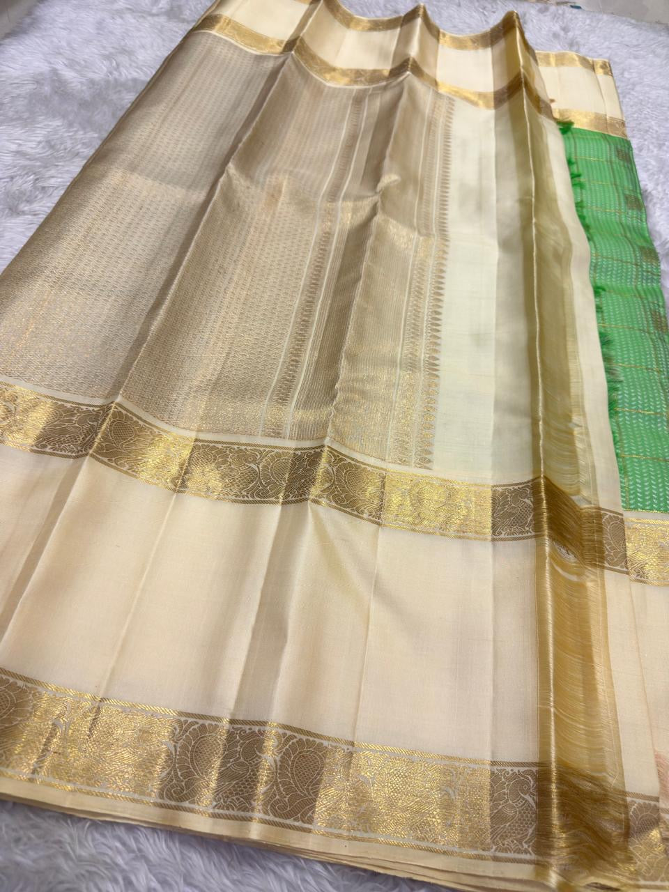 Fresh green Kancheepuram Zari Kattam saree folded view — Idam Living