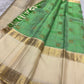 Zari grid detail close-up on fresh green Kancheepuram saree