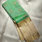 Ivory-gold border detail second angle on fresh green Kancheepuram saree
