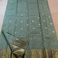 Mayil and Kamalam zari buttas within the Zari Kattam checks, dewdrop sage green Kanjeevaram saree.