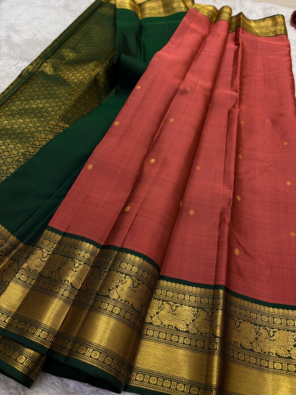Pure silk Kancheepuram saree in rust orange with deep green border