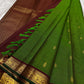 Green Kanjivaram silk saree with traditional antique gold grid detailing