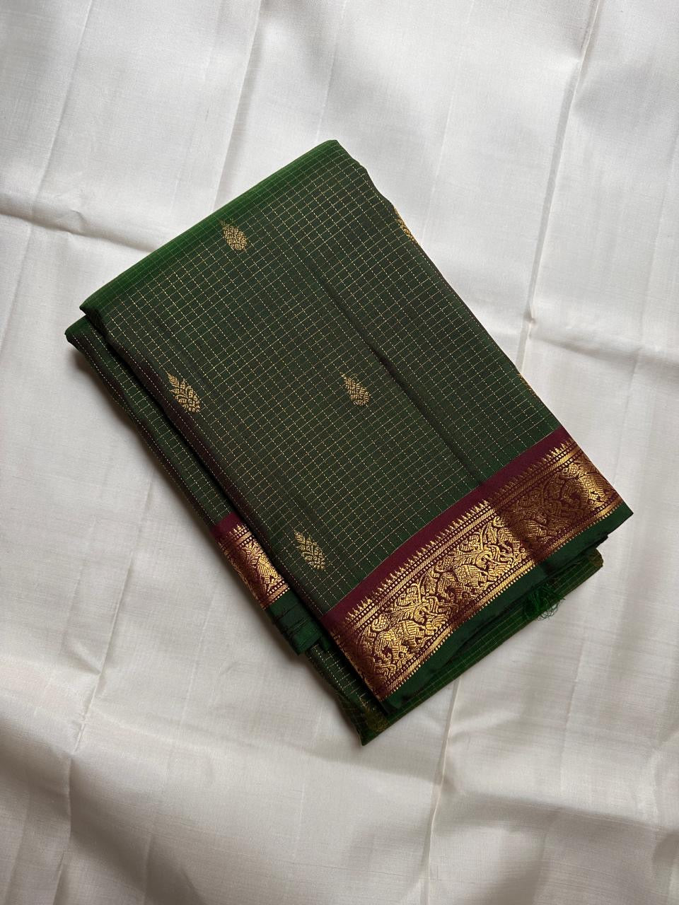 Handwoven forest emerald silk saree with antique gold woven kattam checks