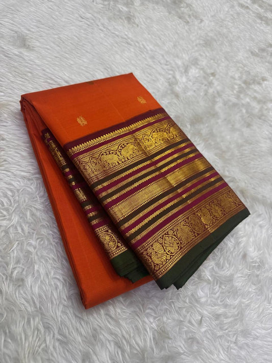 Aubergine Korvai elephant motif detail on Burnt Orange Kanchipuram silk saree