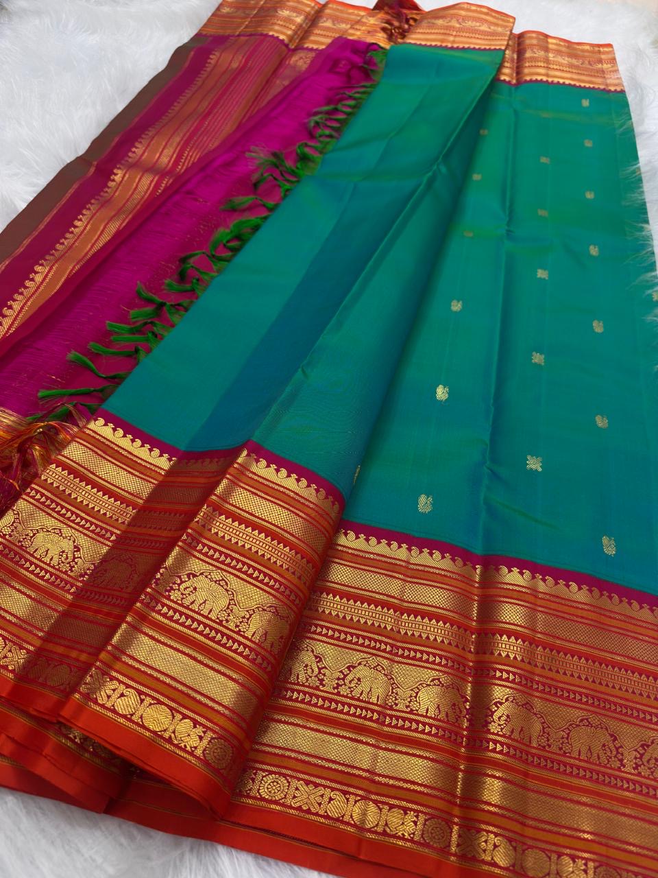 Vermilion Varisaipet elephant motif detail on Peacock Teal KanchiPattu silk saree