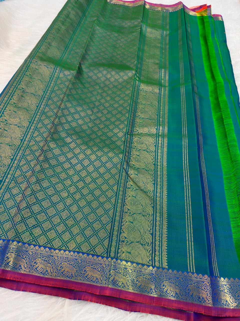 Peacock Blue Handwoven Pure Silk KanchiPattu Saree with Small Gold Buttas & Petite Zari Elephant Border
