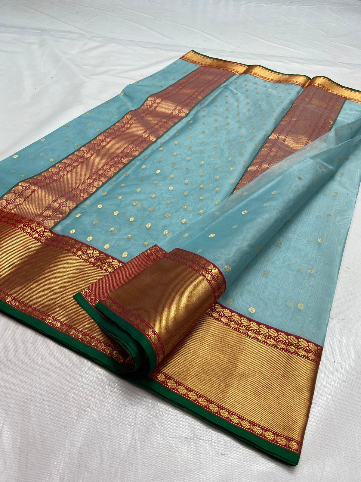 Pure Silk Chanderi pale blue saree with gold-toned buttas