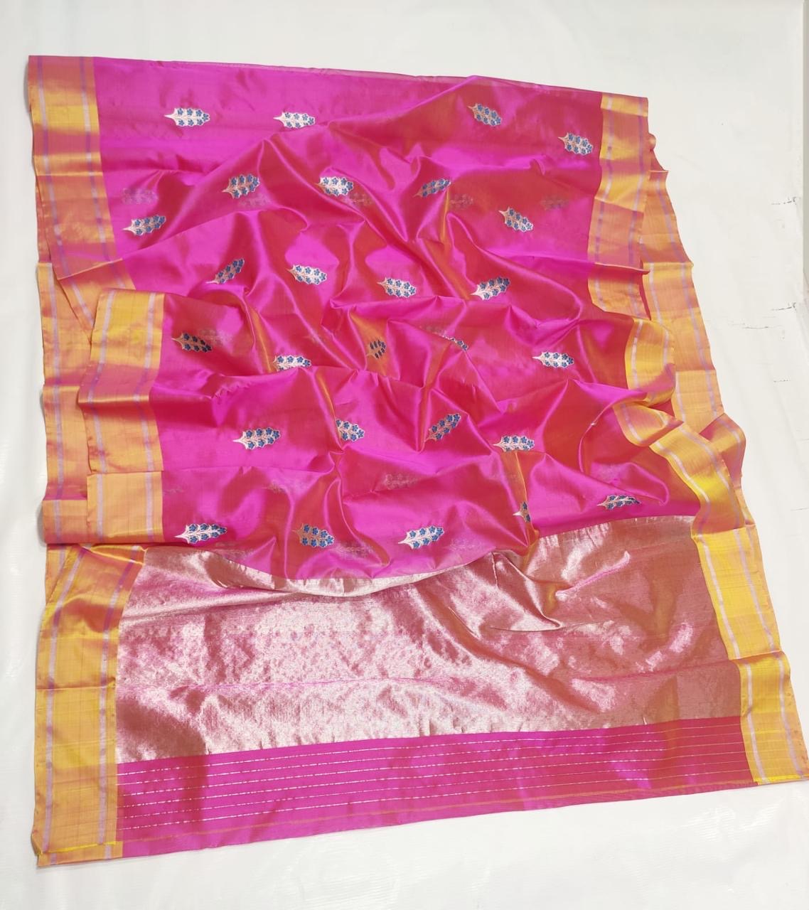Pure Silk Chanderi saree showing blue blossoms and pale metallic stems
