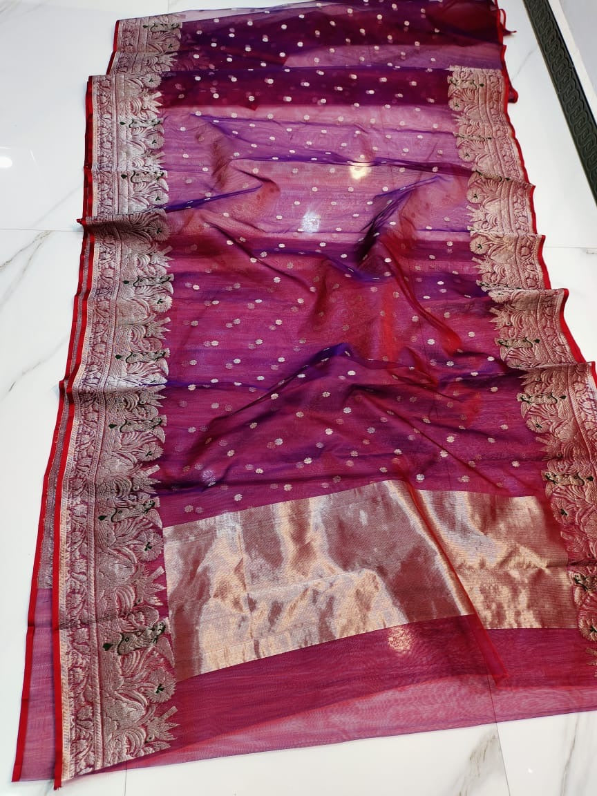Folded berry red Chanderi Katan Silk saree with small silver blossoms and ornate silver-rose floral border