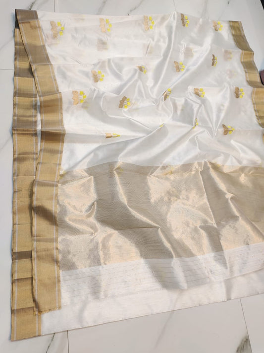Ivory Cloud Finish Pure Silk Chanderi Saree neatly folded with Antique Gold Border Border