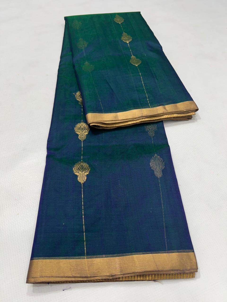 Elegant peacock tone Chanderi silk saree with subtle sheen and fluid drape