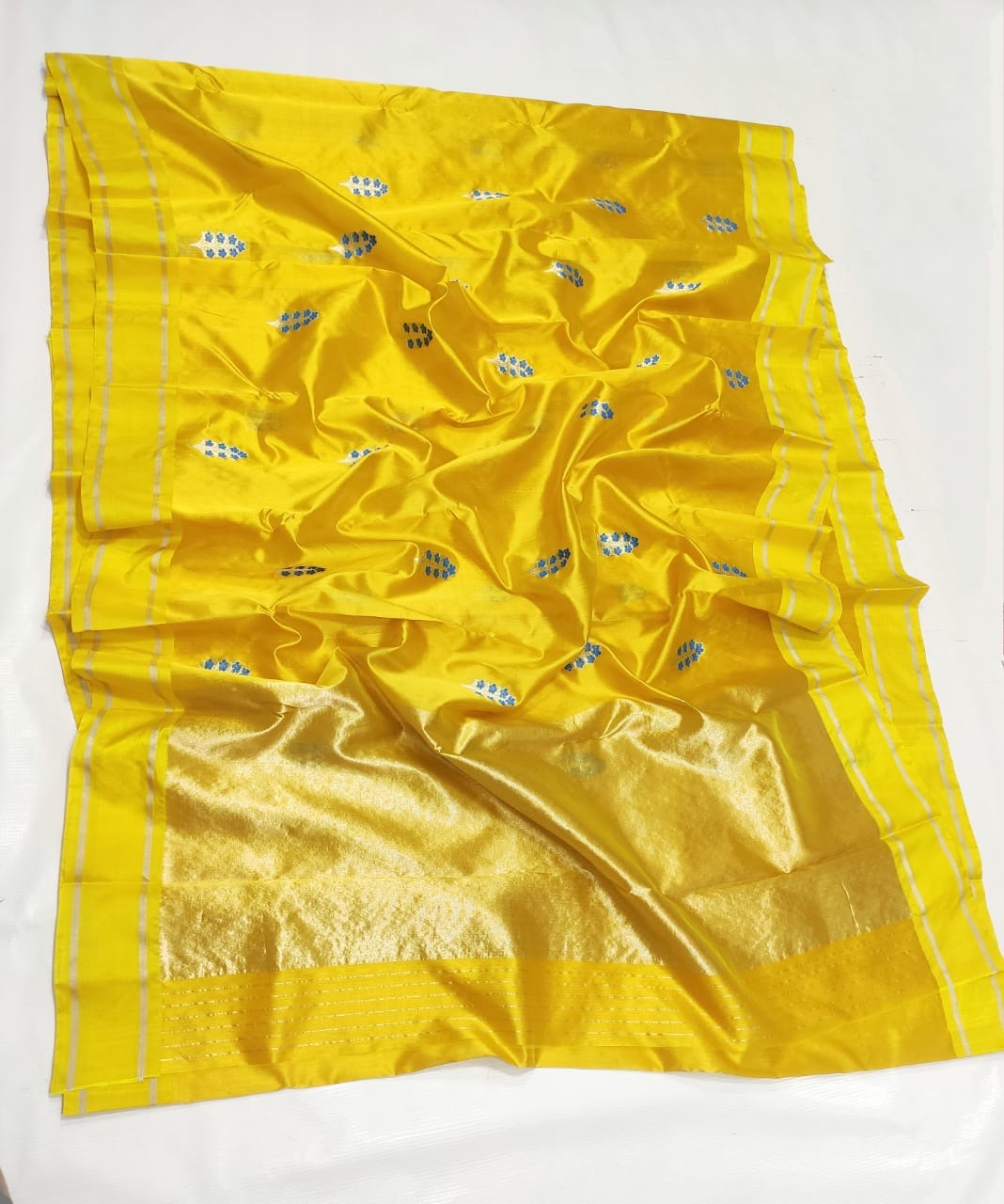 Pure Silk Chanderi saree with blue blossoms and pale metallic stems