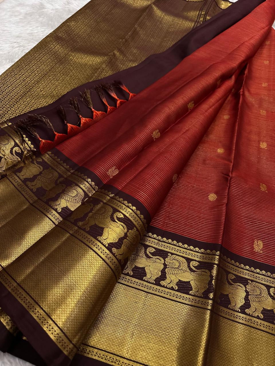 Pure silk Kanchi Pattu saree — deep aubergine zari border close-up