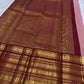 Dusty rose Kanchi Pattu saree pallu with ornate maroon zari border detail