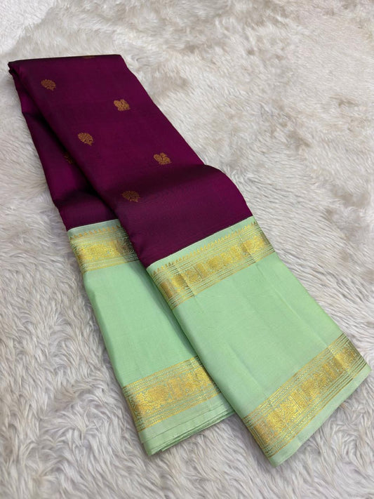 Pure Kanjivaram silk saree in rich berry plum with soft pistachio green traditional zari border