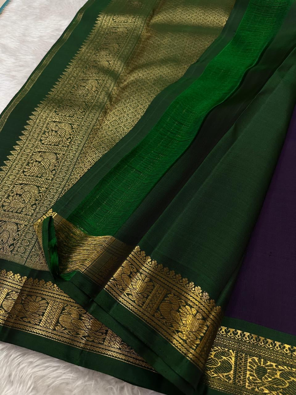 Deep Purple Kanchipuram saree with hand-joined Forest Green Korvai border