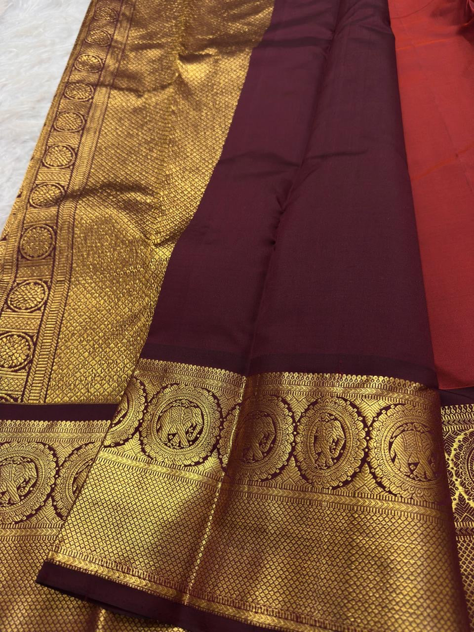 Rich petal pink pallu detail on bright vermilion red with a luminous petal pink pallu Kanchipuram silk saree.