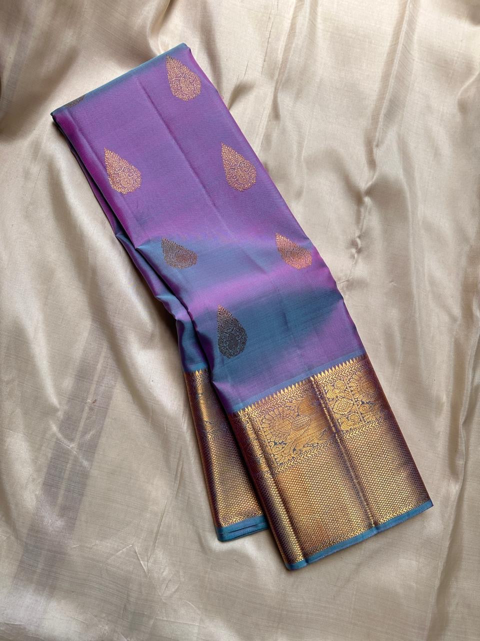 Iridescent Lavender Blue pure silk Kancheepuram saree, Butta weave with Antique Gold Zari border — folded view