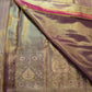 Lavender-gold brocade border with stylised tree motifs, leaf forms, floral rosettes and muted multicolour accents.